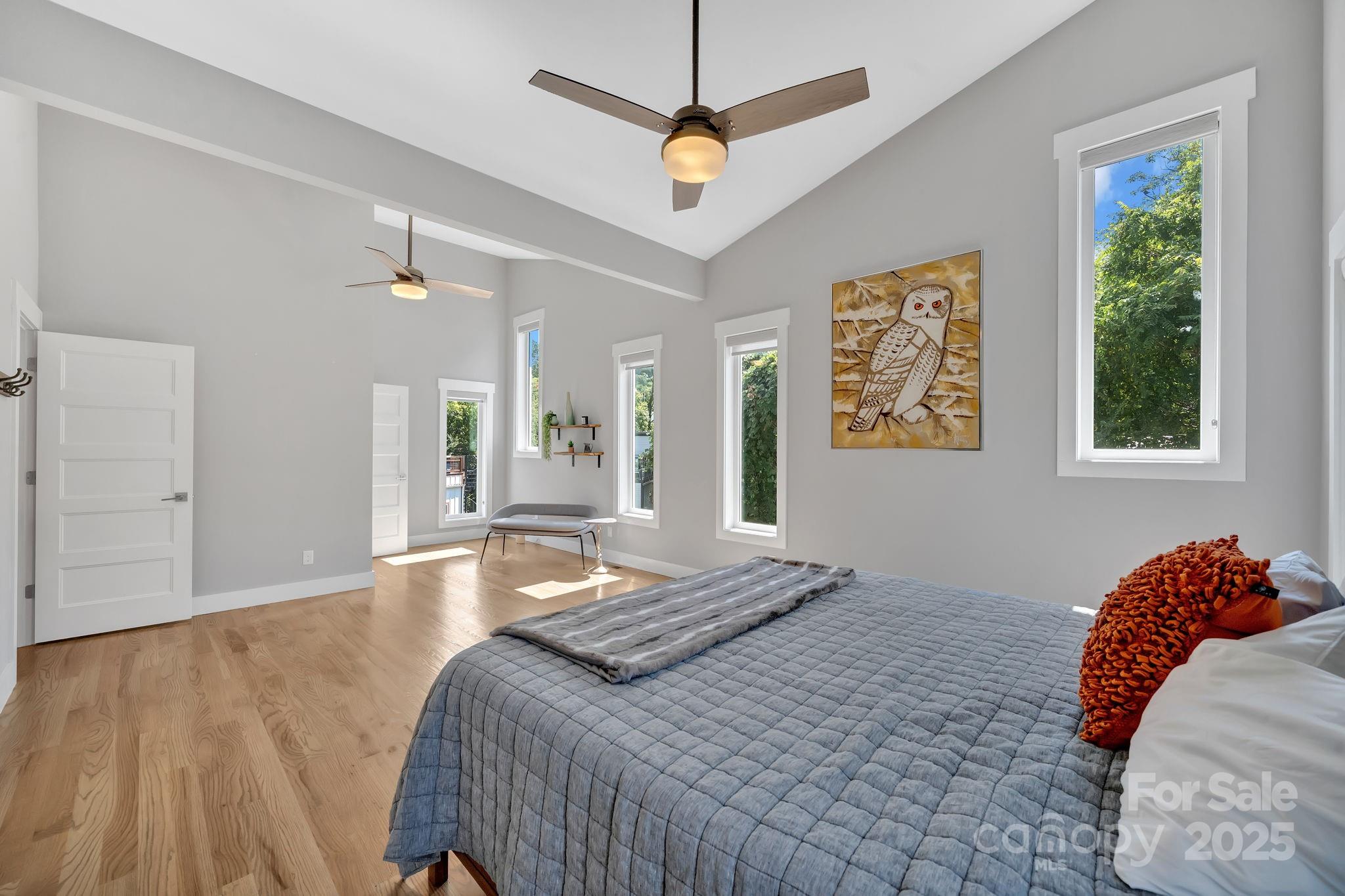 8 Birdhouse Row Asheville, NC 28801 - Photo 12 of 46 a bedroom with a bed ceiling fan and a window