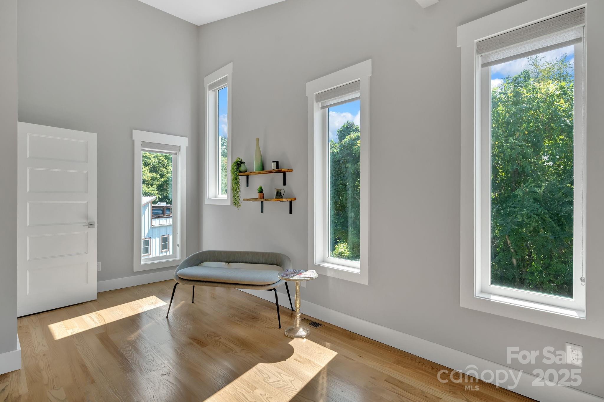 8 Birdhouse Row Asheville, NC 28801 - Photo 13 of 46 a living room with furniture and a window