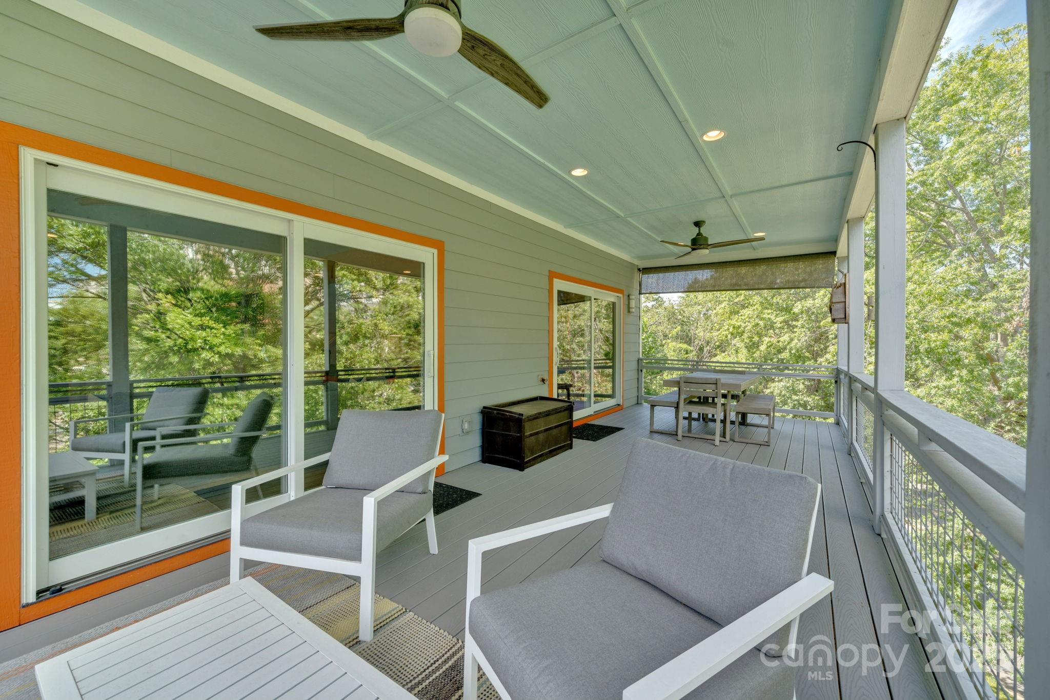8 Birdhouse Row Asheville, NC 28801 - Photo 27 of 46 a living room with large windows