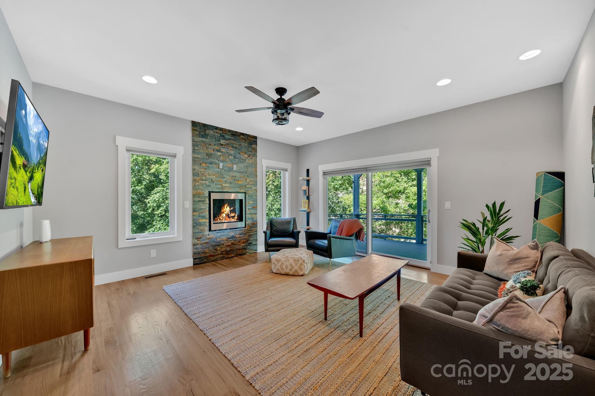 8 Birdhouse Row Asheville, NC 28801 - Photo 33 of 46 a living room with furniture fireplace and window