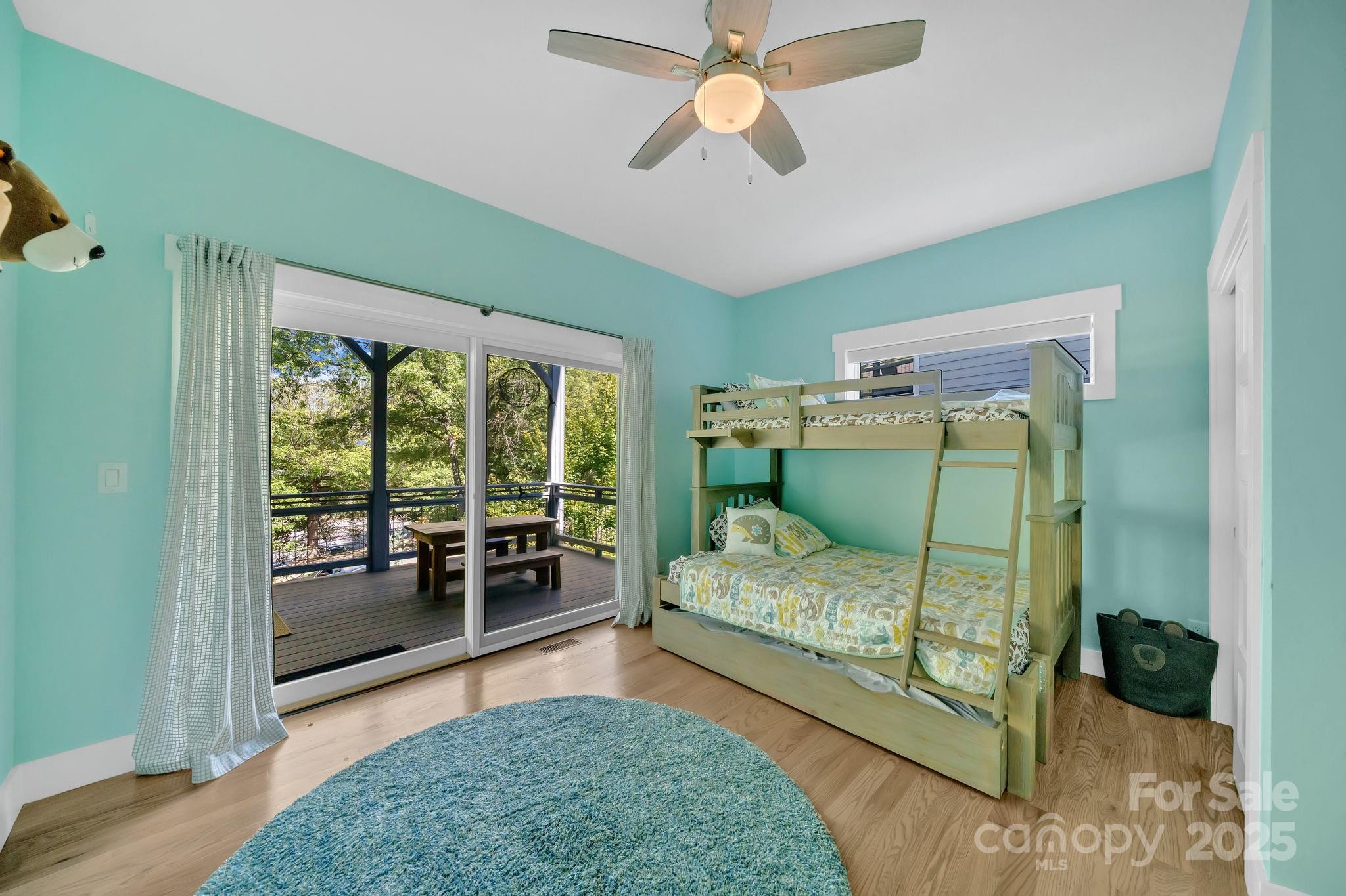 8 Birdhouse Row Asheville, NC 28801 - Photo 38 of 46 a bedroom with a bed and a walk in closet