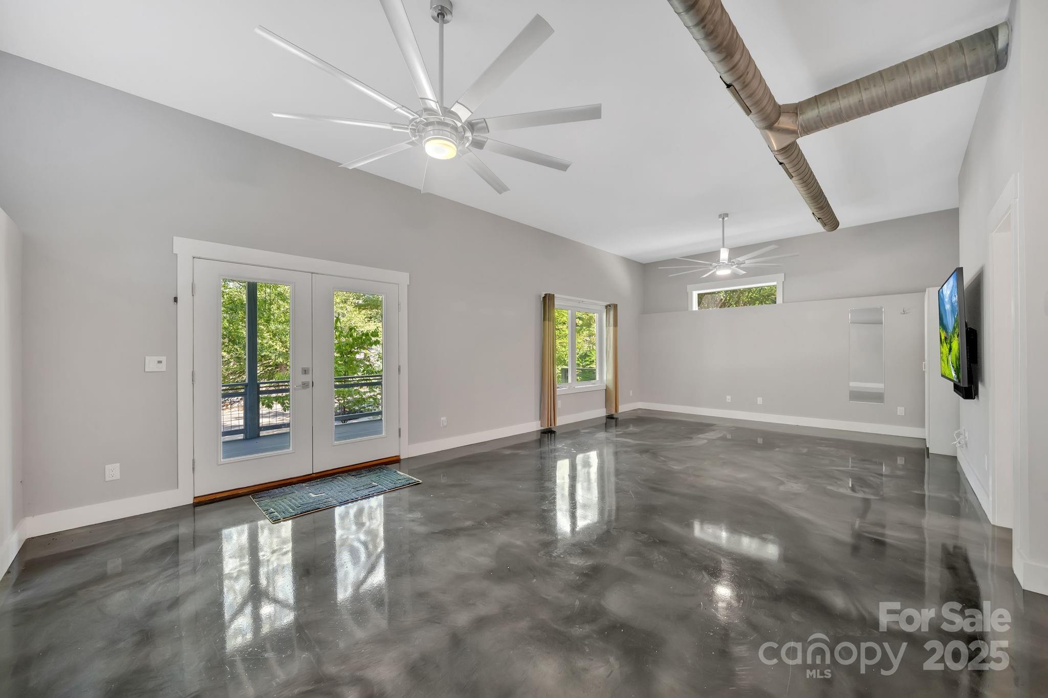 8 Birdhouse Row Asheville, NC 28801 - Photo 42 of 46 a view of an empty room with a window