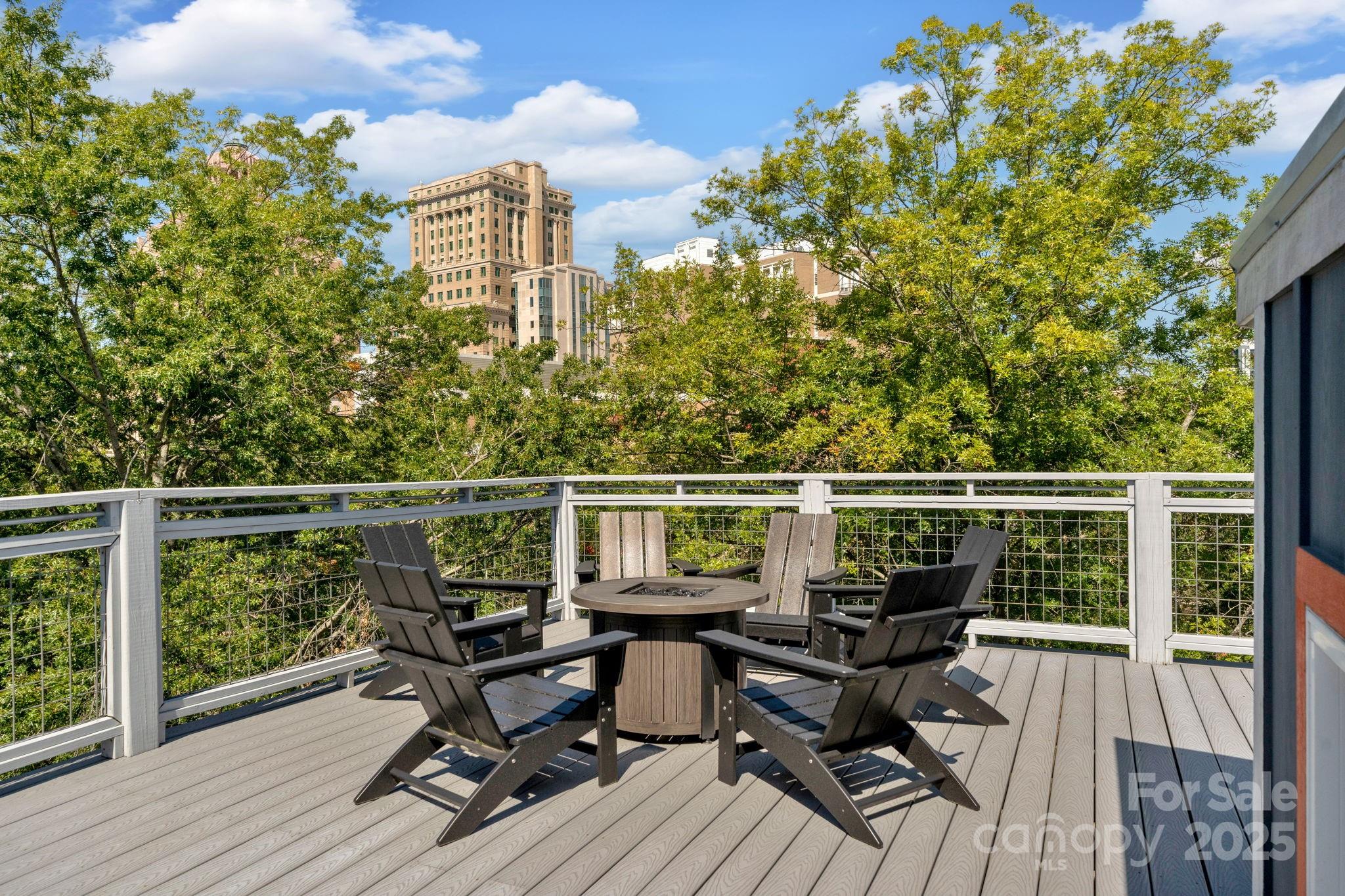 8 Birdhouse Row Asheville, NC 28801 - Photo 46 of 46 a view of a balcony with chair and wooden floor