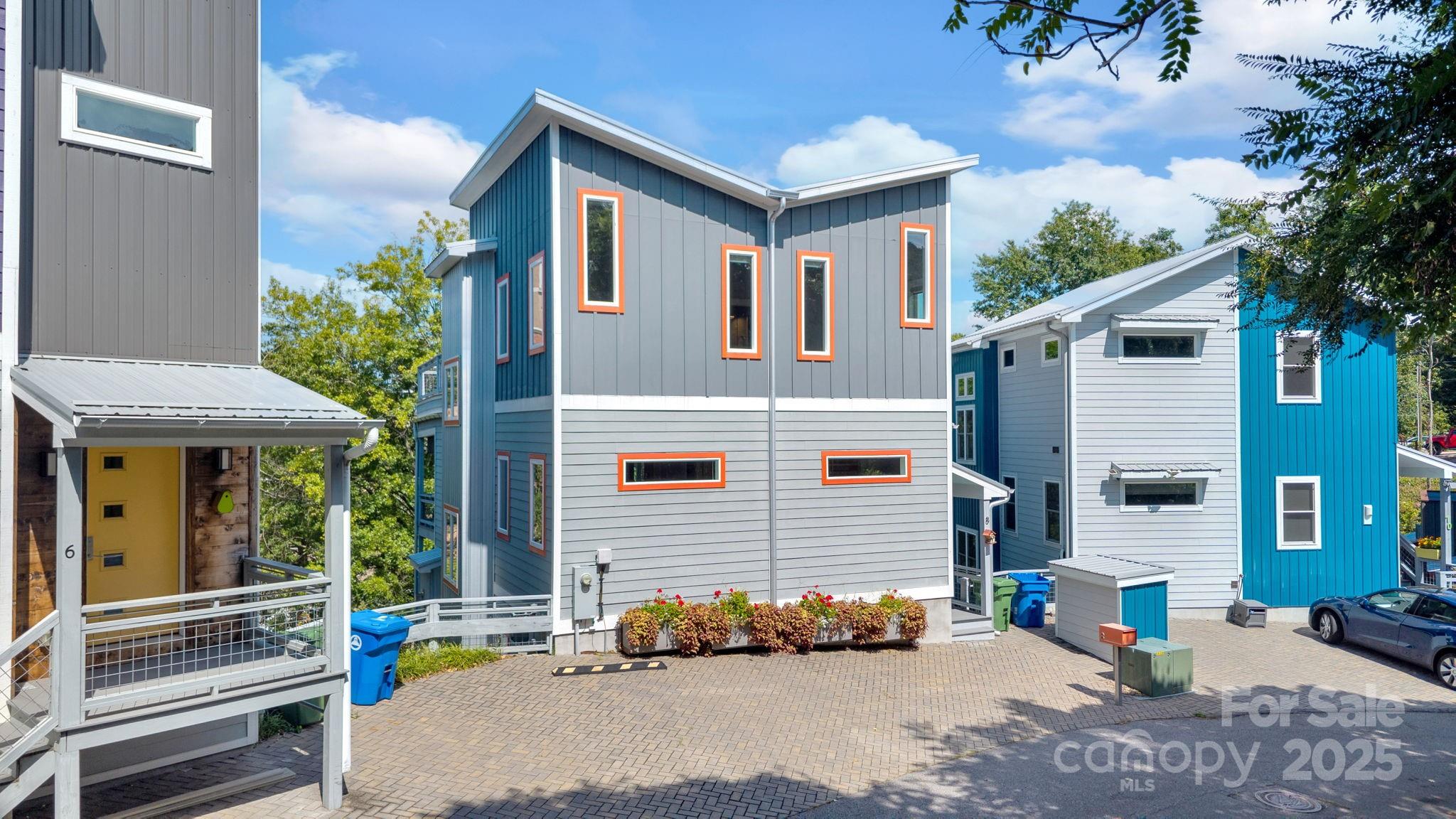 8 Birdhouse Row Asheville, NC 28801 - Photo 5 of 46 a front view of a house with a yard