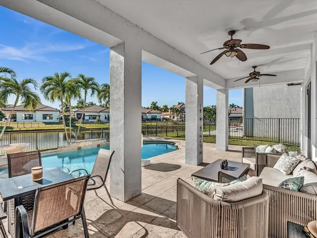 a view of a swimming pool with a patio