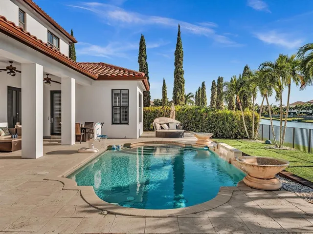 a front view of a house with porch and garden