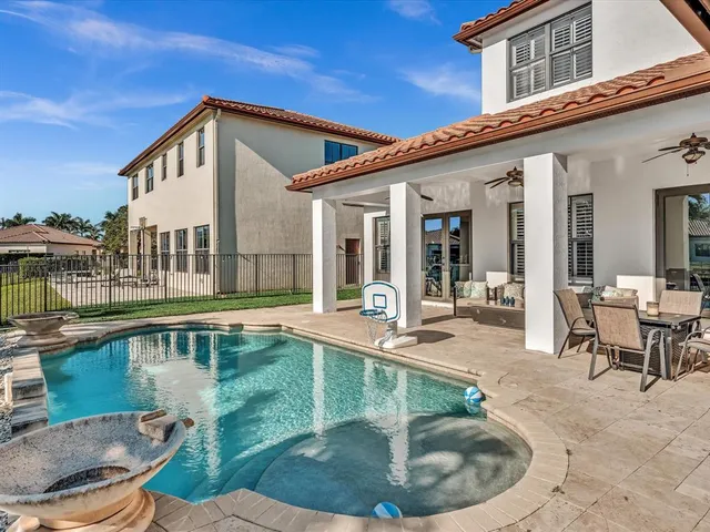 a view of a patio with table and chairs