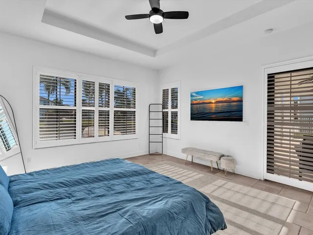 a bathroom with a tub a double vanity sink and mirror