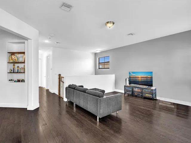 a bedroom with bed and window
