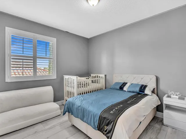 a bedroom with a bed and a table