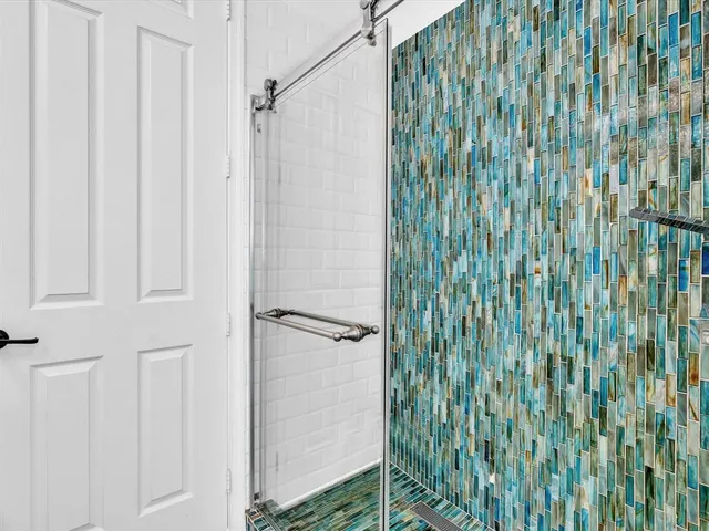 an aerial view of residential house with outdoor space and swimming pool