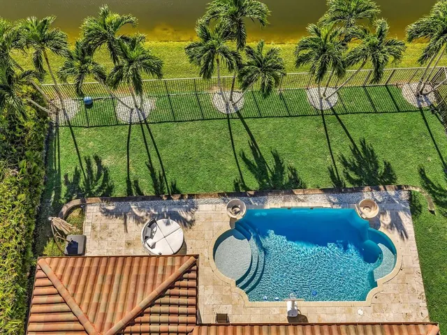 a view of swimming pool with outdoor seating and hardwood floor