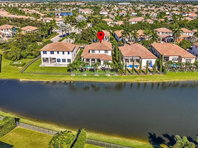 a view of a patio with dining table and chairs with plants and trees