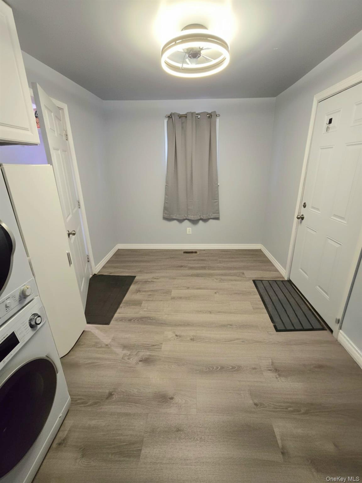 111-18 124th Street Queens, NY 11420 - Photo 11 of 16 a view of an empty room with a fireplace