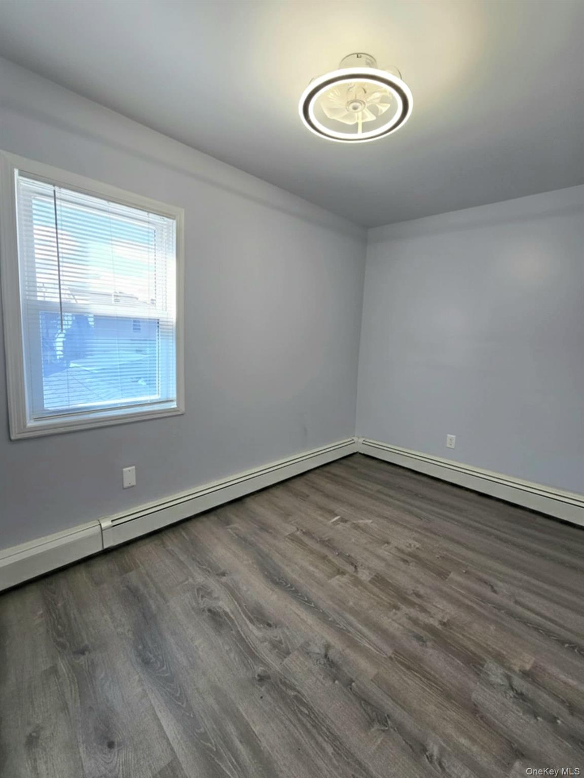 111-18 124th Street Queens, NY 11420 - Photo 14 of 16 an empty room with a window