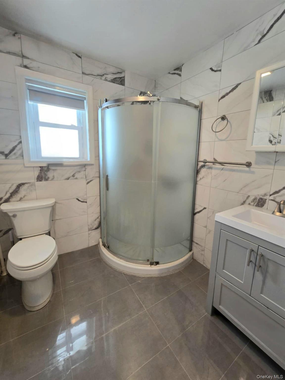 111-18 124th Street Queens, NY 11420 - Photo 15 of 16 a bathroom with a sink toilet and shower