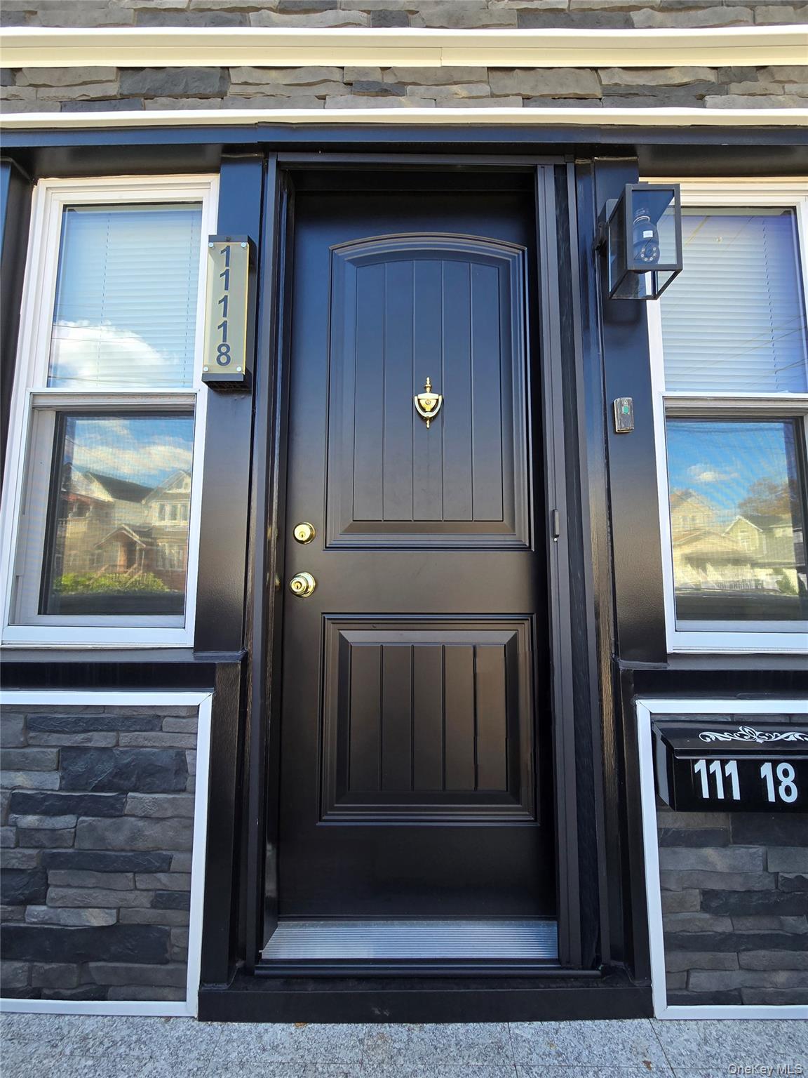 111-18 124th Street Queens, NY 11420 - Photo 4 of 16 a view of a door of the house