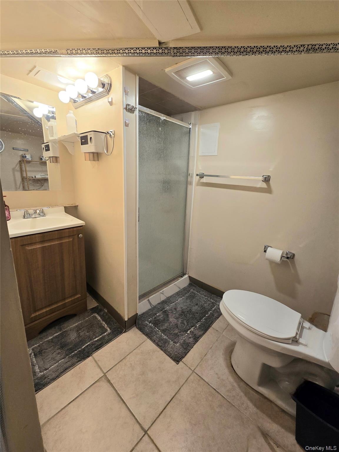 111-18 124th Street Queens, NY 11420 - Photo 8 of 16 a bathroom with a sink a toilet and shower