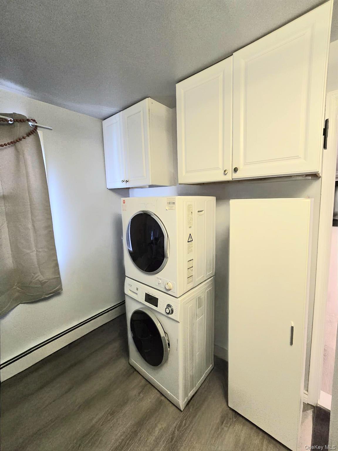 111-18 124th Street Queens, NY 11420 - Photo 10 of 16 a utility room with dryer and washer