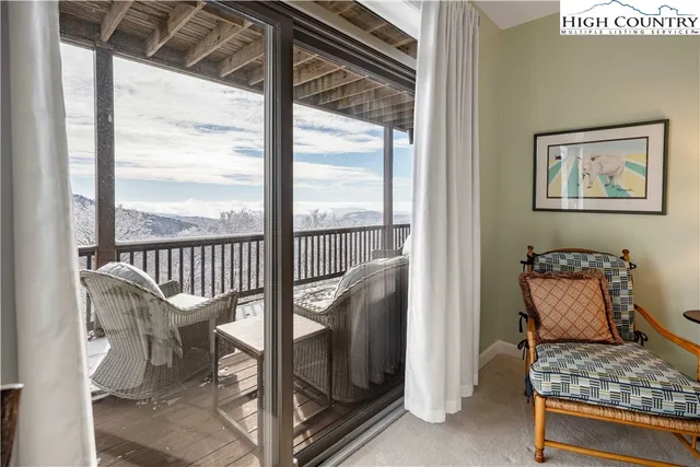 a view of a balcony with furniture