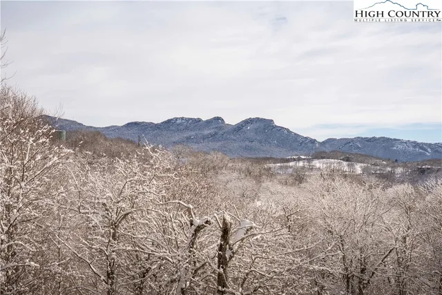 a view of a large body of mountains and valleys