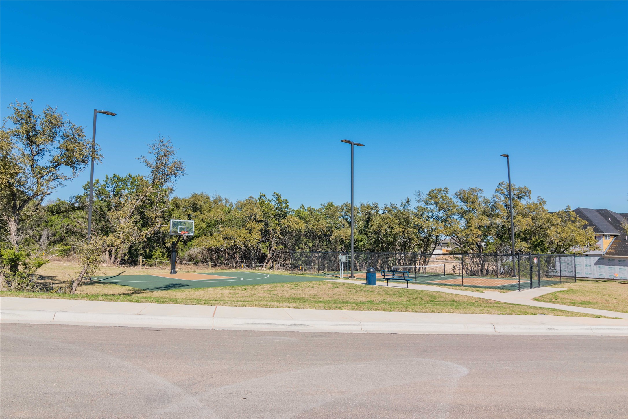 1252 Lavender Way Georgetown, TX 78628 - Photo 18 of 23 a view of a swimming pool with a building in the background