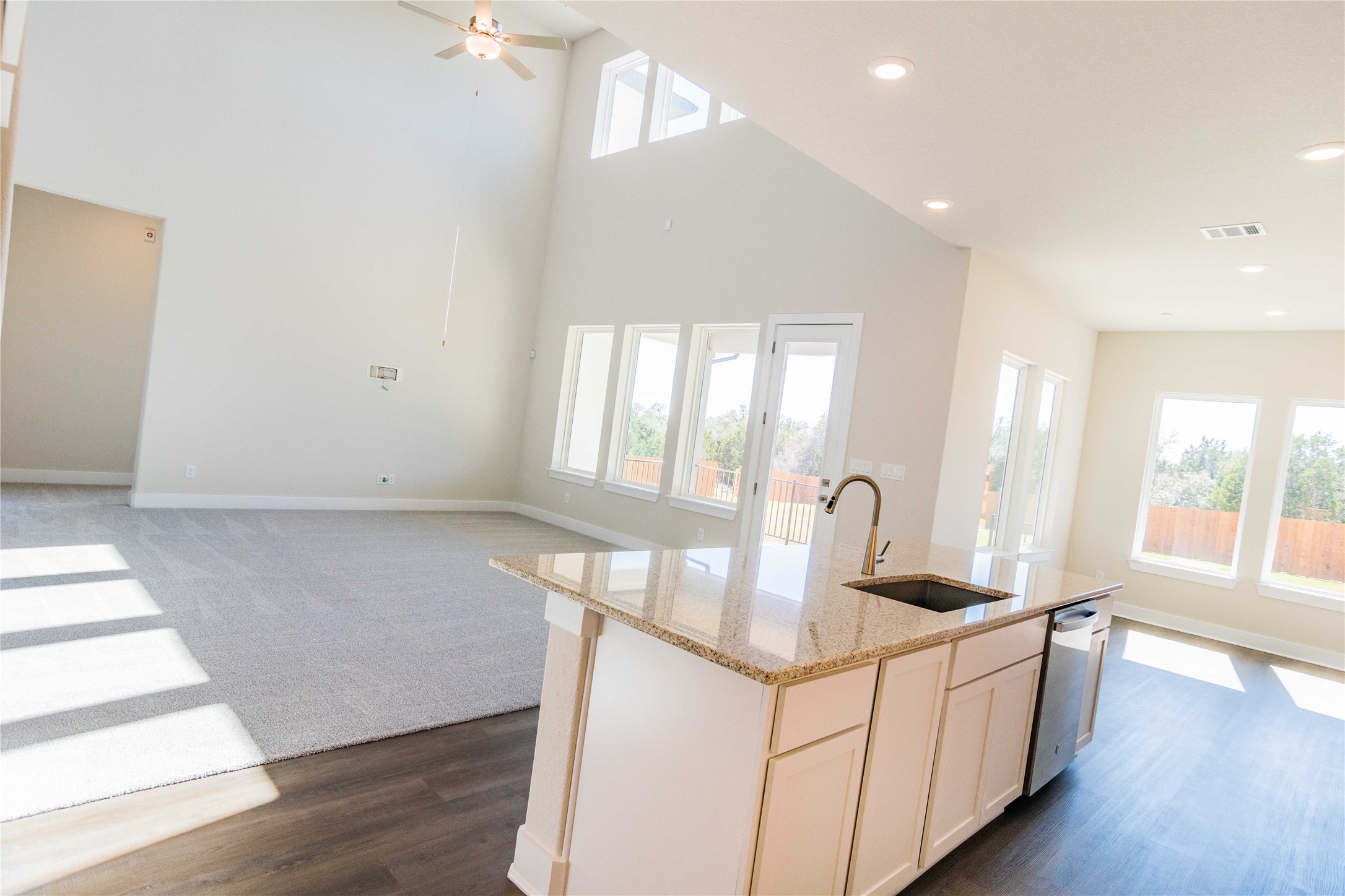 1252 Lavender Way Georgetown, TX 78628 - Photo 22 of 23 a kitchen with stainless steel appliances granite countertop a sink and a wooden floors