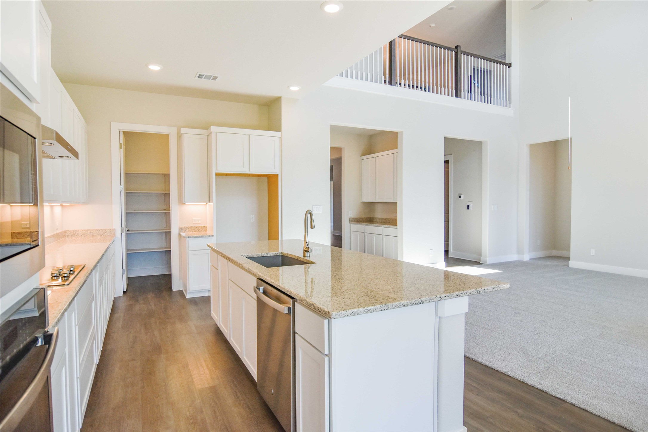 1252 Lavender Way Georgetown, TX 78628 - Photo 8 of 23 a kitchen with granite countertop a sink stove and refrigerator