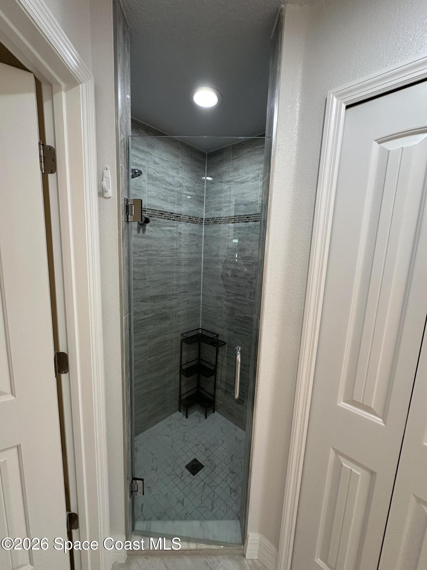 650 Rockinghorse Road Melbourne, FL 32935 - Photo 15 of 16 a bathroom with a shower and a sink
