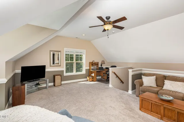 a view of a livingroom with furniture and a flat screen tv