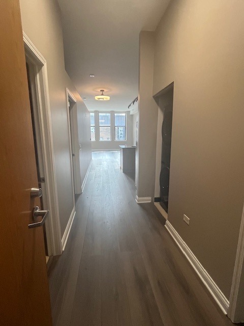 8 West Monroe Street, Unit 1102 Chicago, IL 60603 - Photo 2 of 18 a view of a hallway with wooden floor