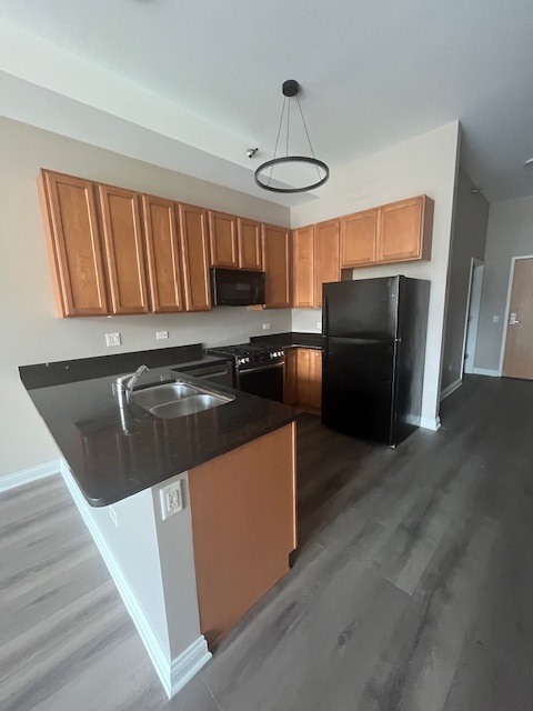 8 West Monroe Street, Unit 1102 Chicago, IL 60603 - Photo 4 of 18 a kitchen with stainless steel appliances granite countertop a refrigerator a stove a sink and a refrigerator