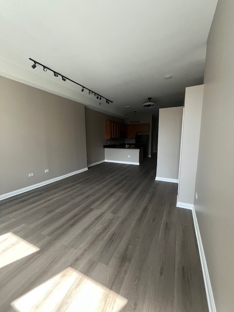 8 West Monroe Street, Unit 1102 Chicago, IL 60603 - Photo 5 of 18 a view of empty room with wooden floor