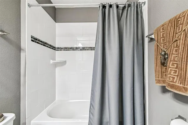 a view of a patio with table and chairs potted plants and palm tree