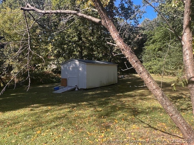 7905 Harps Mill Road Raleigh, NC 27615 - Photo 11 of 13 a backyard of a house with lots of green space