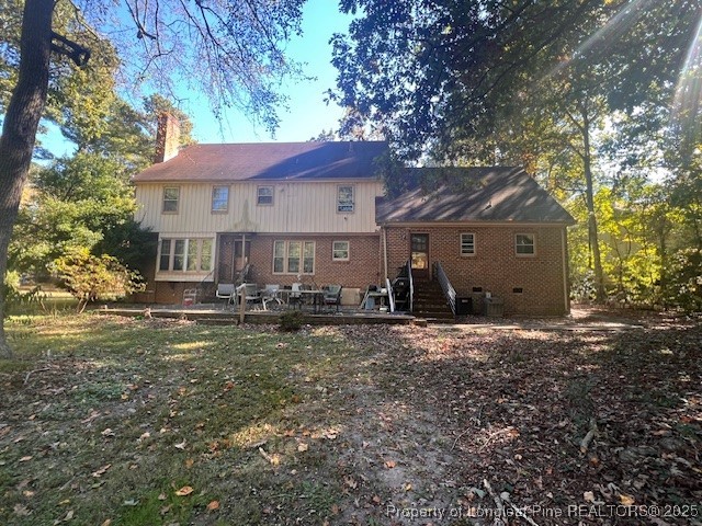 7905 Harps Mill Road Raleigh, NC 27615 - Photo 8 of 13 a front view of a house with yard patio and fire pit