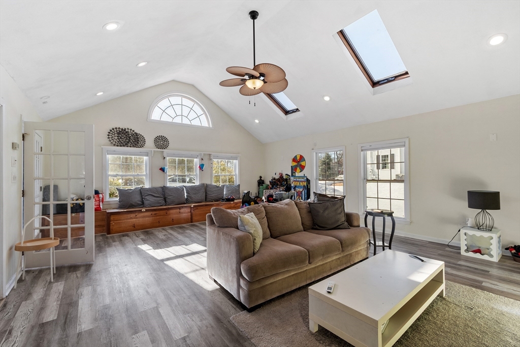 45 Main Street Chelmsford, MA 01863 - Photo 15 of 42 a living room with furniture and a chandelier