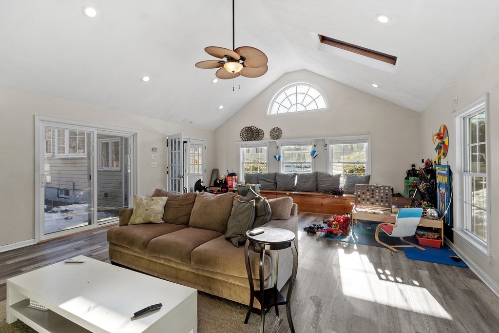 45 Main Street Chelmsford, MA 01863 - Photo 16 of 42 a living room with furniture a chandelier and a large window