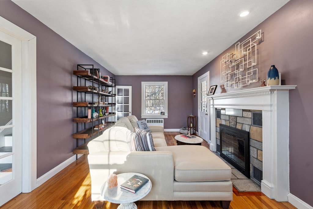45 Main Street Chelmsford, MA 01863 - Photo 23 of 42 a living room with furniture and a fireplace