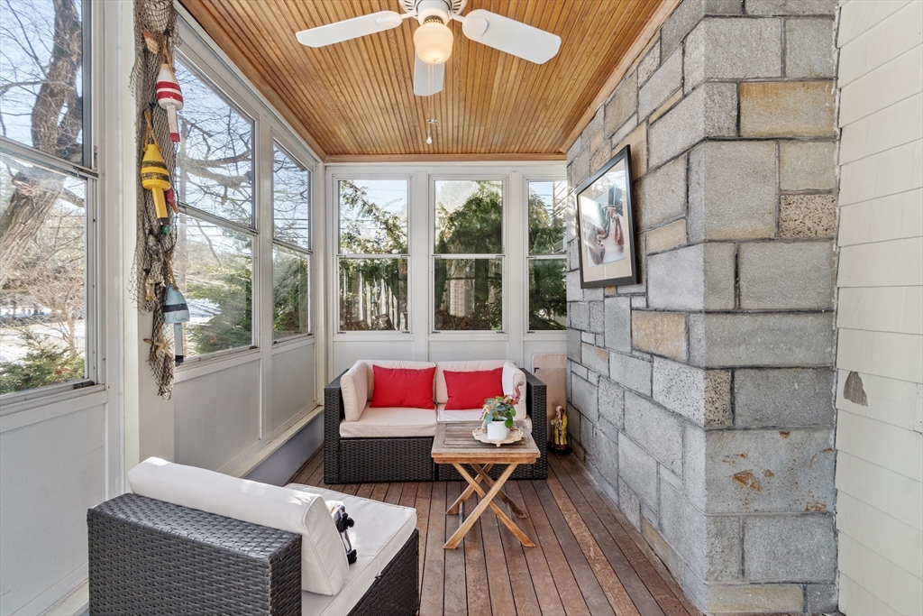 45 Main Street Chelmsford, MA 01863 - Photo 24 of 42 a living room with furniture and a floor to ceiling window
