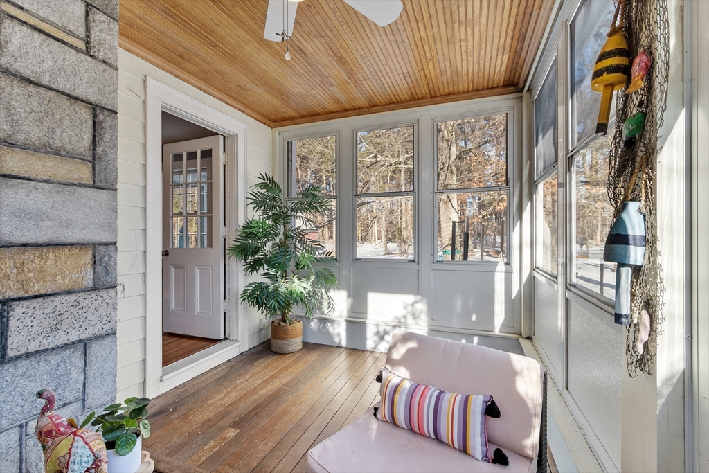45 Main Street Chelmsford, MA 01863 - Photo 25 of 42 a living room with furniture and a potted plant
