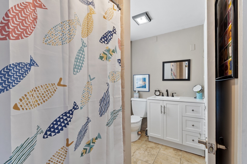 45 Main Street Chelmsford, MA 01863 - Photo 33 of 42 a view of cabinets with entryway and wooden floor