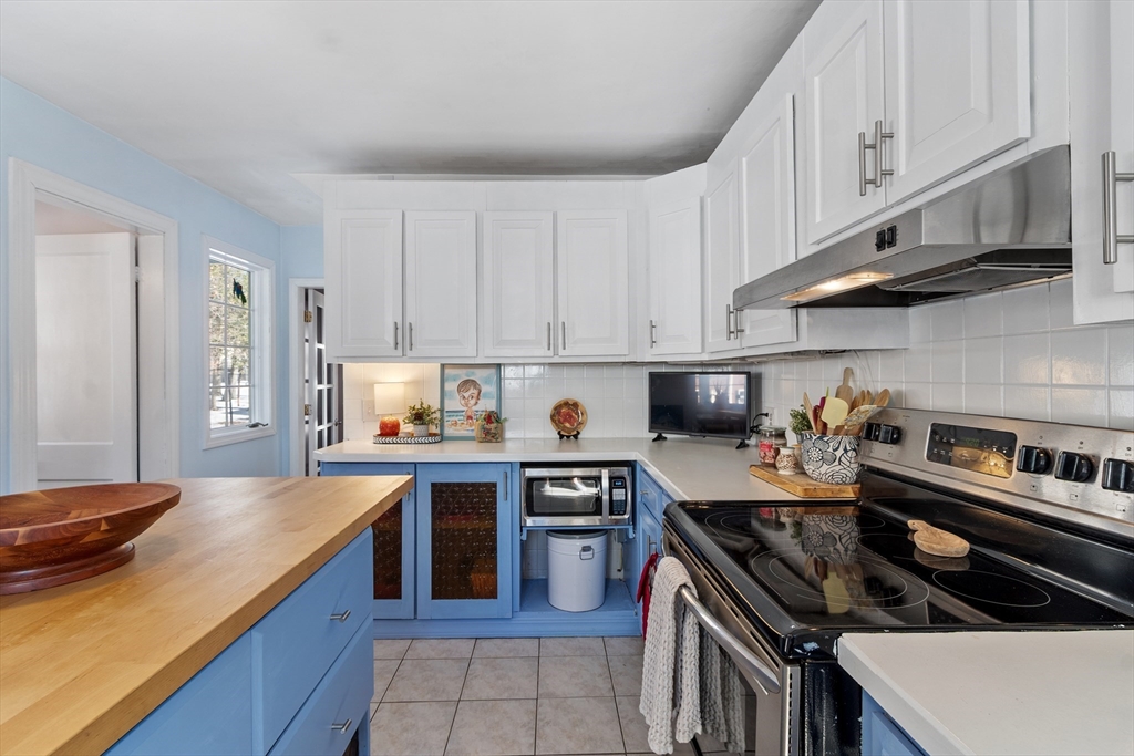 45 Main Street Chelmsford, MA 01863 - Photo 8 of 42 a kitchen with stainless steel appliances a sink dishwasher stove and refrigerator