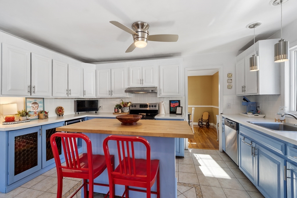45 Main Street Chelmsford, MA 01863 - Photo 10 of 42 a kitchen with a stove a sink a refrigerator and cabinets