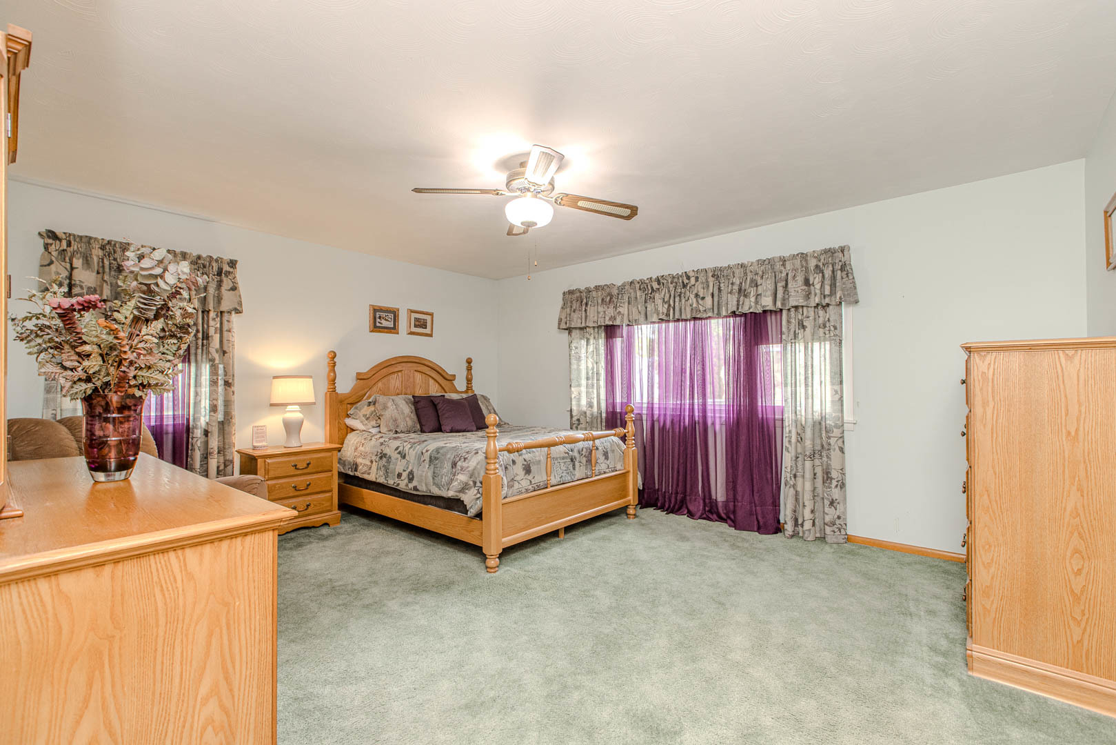 1207 Russell Street Normal, IL 61761 - Photo 11 of 23 a spacious bedroom with a bed and a chandelier