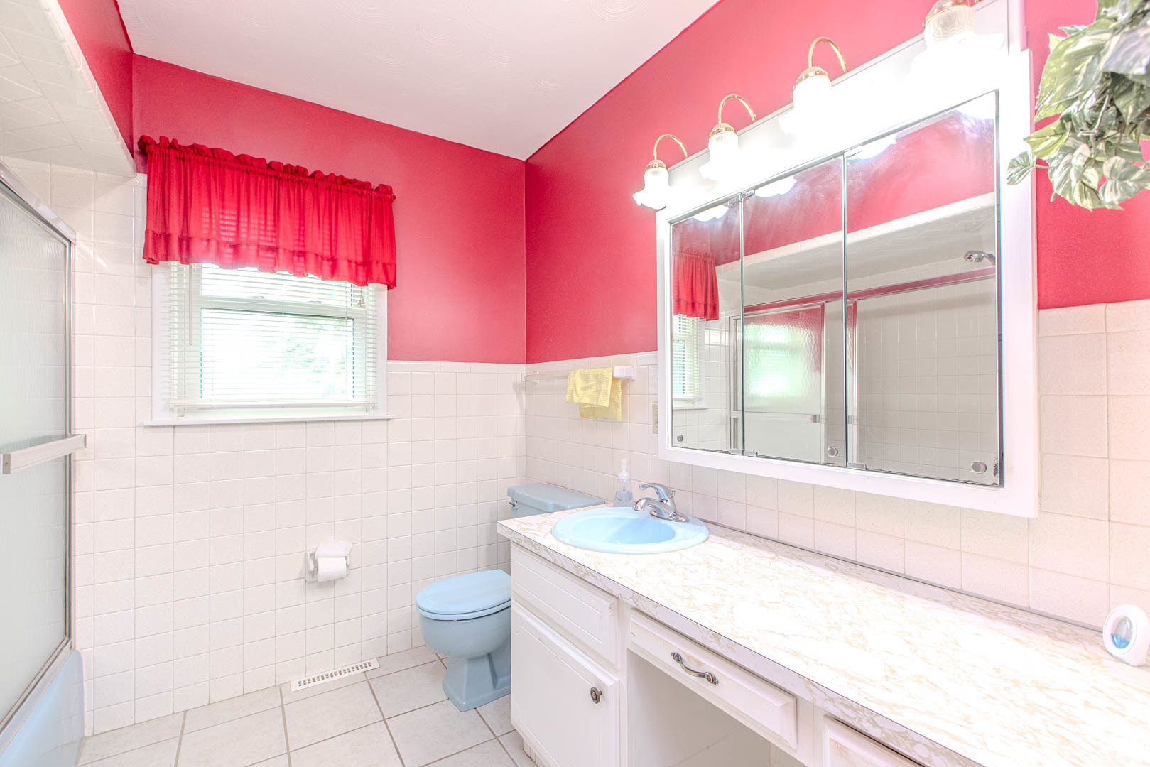 1207 Russell Street Normal, IL 61761 - Photo 14 of 23 a bathroom with a granite countertop bathtub sink vanity mirror and a toilet