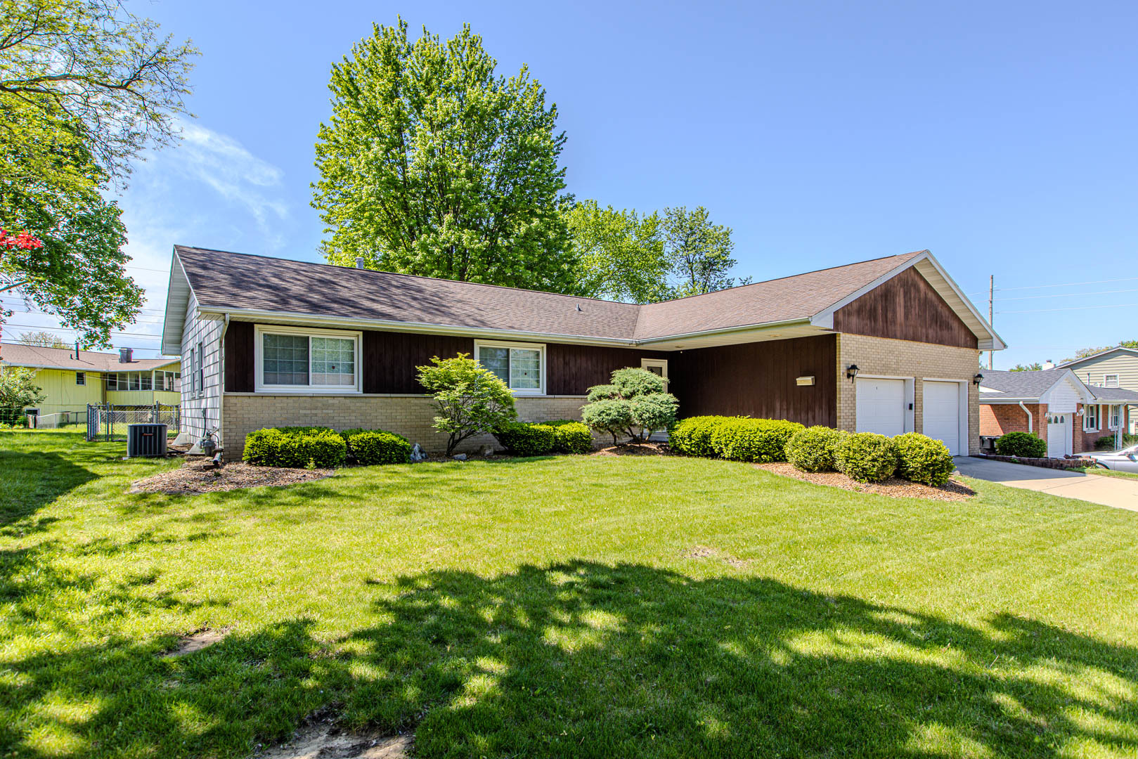 1207 Russell Street Normal, IL 61761 - Photo 2 of 23 a front view of a house with a yard and garage