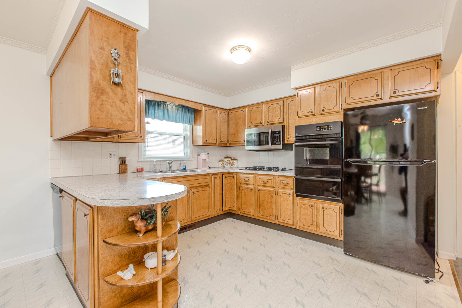 1207 Russell Street Normal, IL 61761 - Photo 8 of 23 a kitchen with stainless steel appliances granite countertop a sink a stove and cabinets