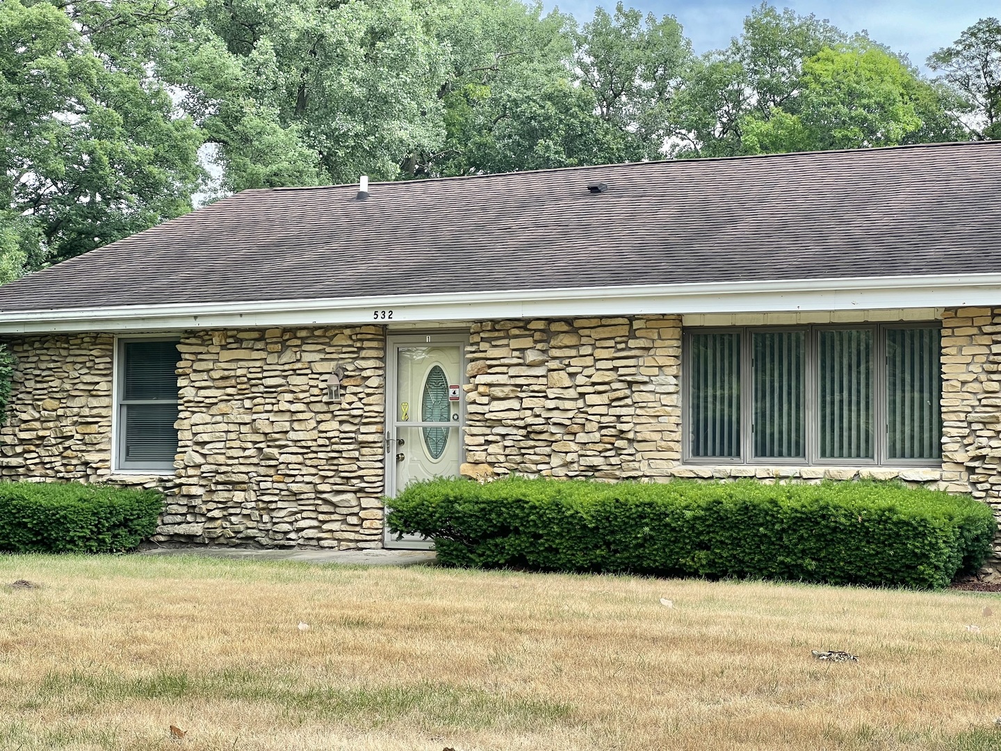 a front view of a house with a yard