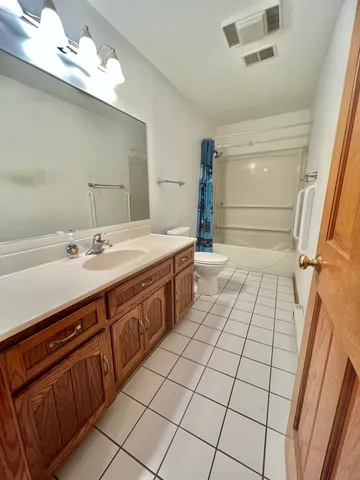 a bathroom with a sink a double vanity and a mirror